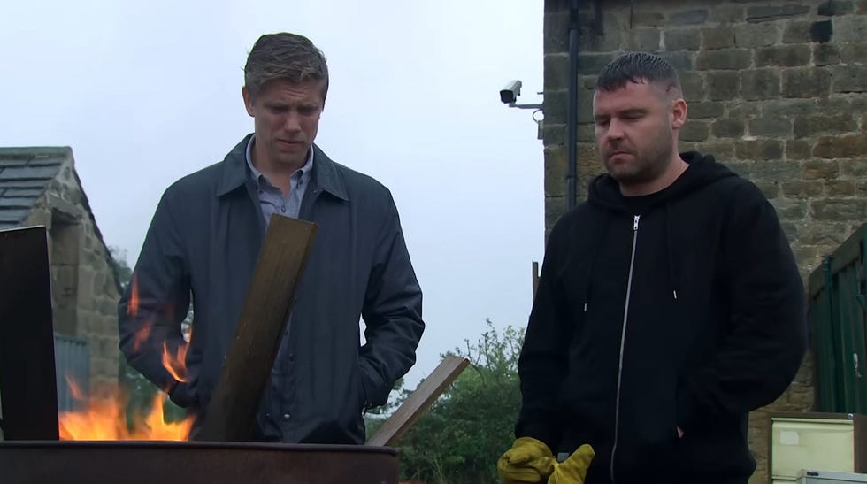 Emmerdale, Robert and Aaron emmerdale, robert and aaron outside watching a burning barrel