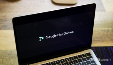 Google Play Games logo on a laptop screen.