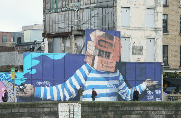 An iconic Dublin city mural has just been removed and replaced with a 'gaudy' NFL display