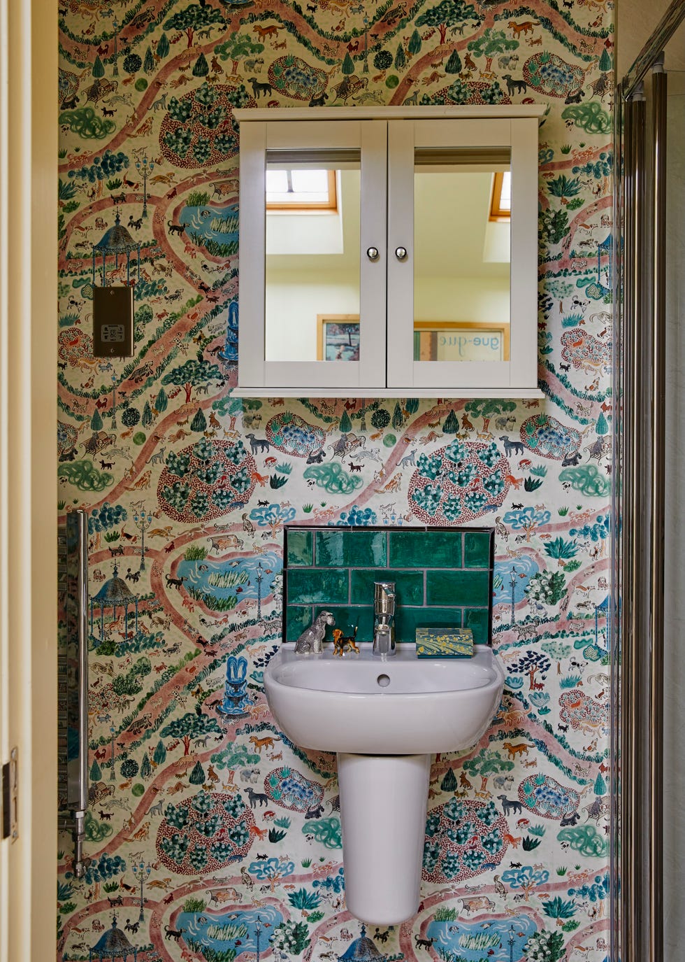 The small downstairs shower room features Emily’s own ‘Dog Park’ wallpaper the small downstairs shower room features emily’s own ‘dog park’ wallpaper, inspired by where she walks mouse.