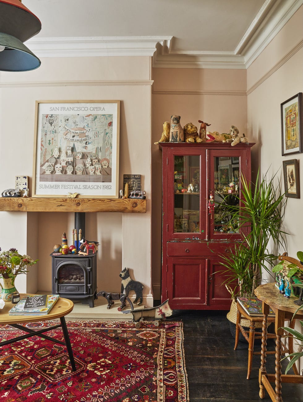 Emily Sutton’s York sitting room with antique cabinet victorian sitting room in emily sutton’s york terrace with antique cabinet, persian rug and pink walls.