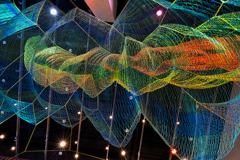 janet echelman suspends lightweight, woven installation within the MIT museum