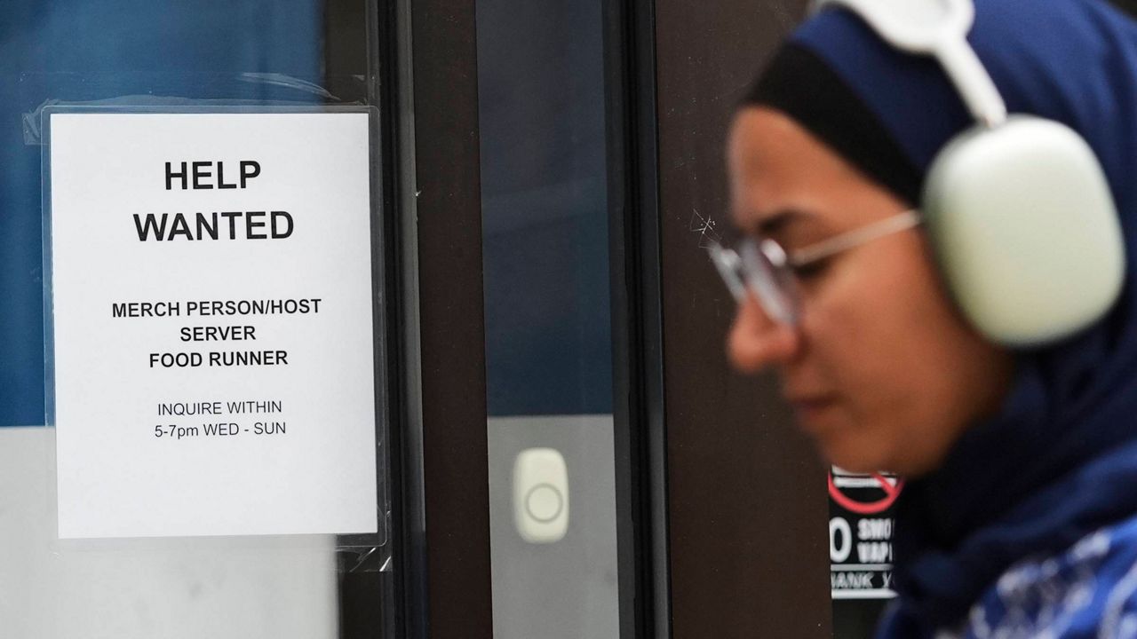 A "help wanted" sign is displayed at a live music and blues club in Chicago, Thursday, July 24, 2025. (AP Photo/Nam Y. Huh, File)