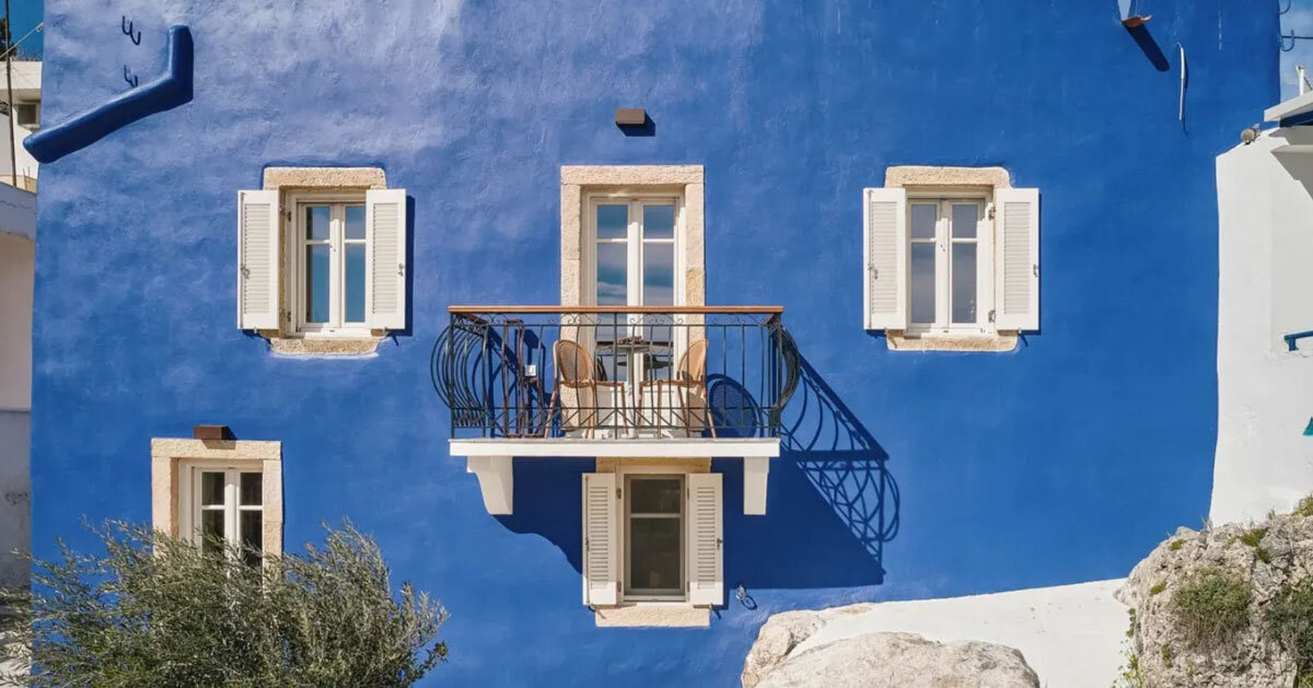 vibrant blue facade brings new life to the monk retreat in leros