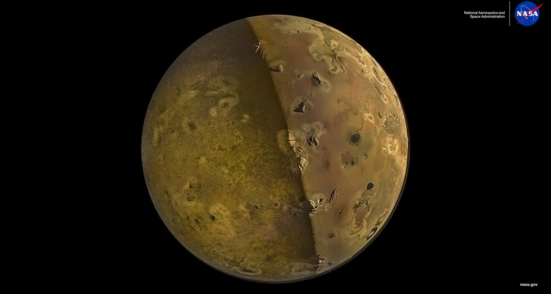 Jupiter's moon, Io, as seen by NASA's Juno spacecraft. Io is yellow-brown and looks somewhat like a potato: some of its geographical features look like the eyes on a potato. Io is partly illuminated by sunshine reflecting off of Jupiter's surface. The darkness of space provides a black background.