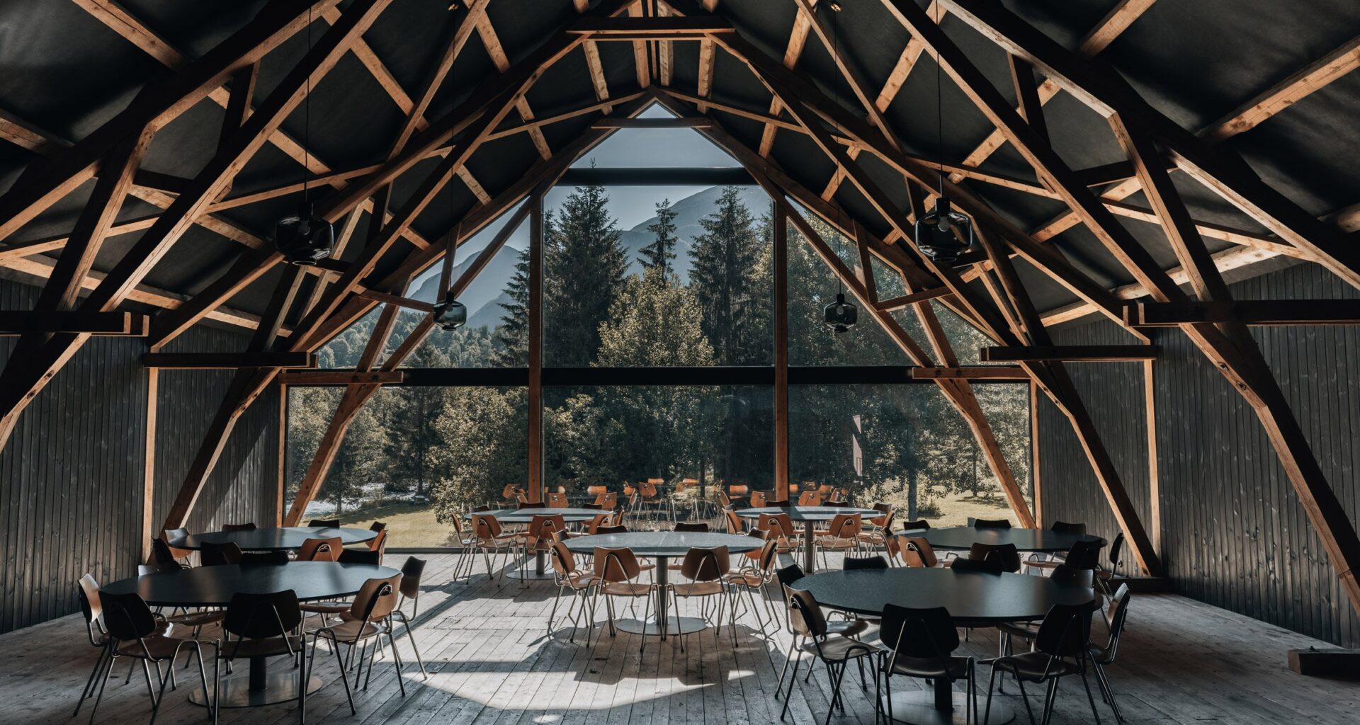 Office Inainn adds timber restaurant to barn in Norway