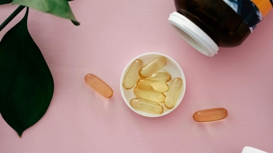 Fish oil supplements help manage blood pressure and promote overall health by supporting vital body functions.(Canva )