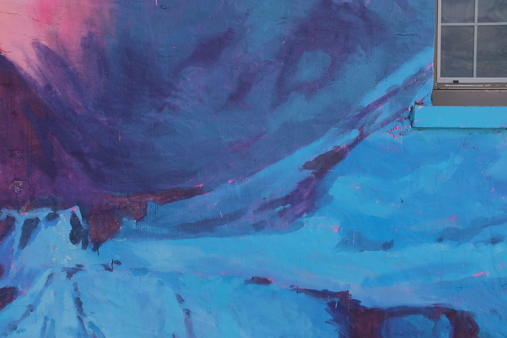 a detail image of a mural by Pat Perry showing snow-covered mountains