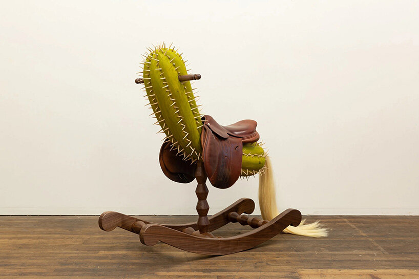 raul de lara carves surreal wooden sculptures to question who gets to belong
