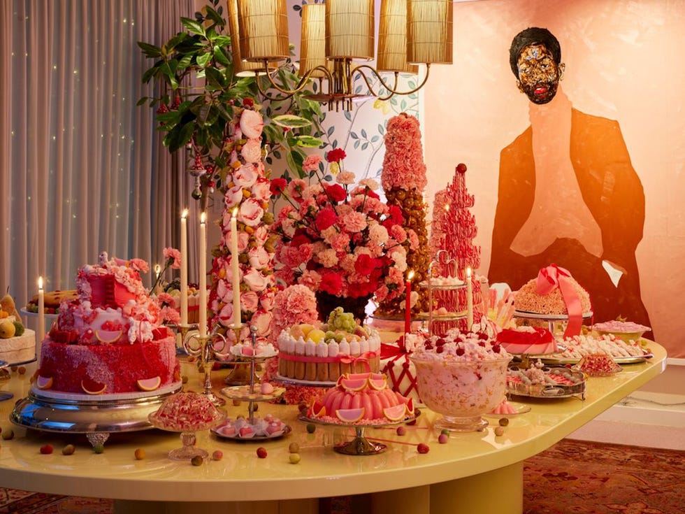 a table with many extravagant pastries on it a table with many extravagant pastries on it