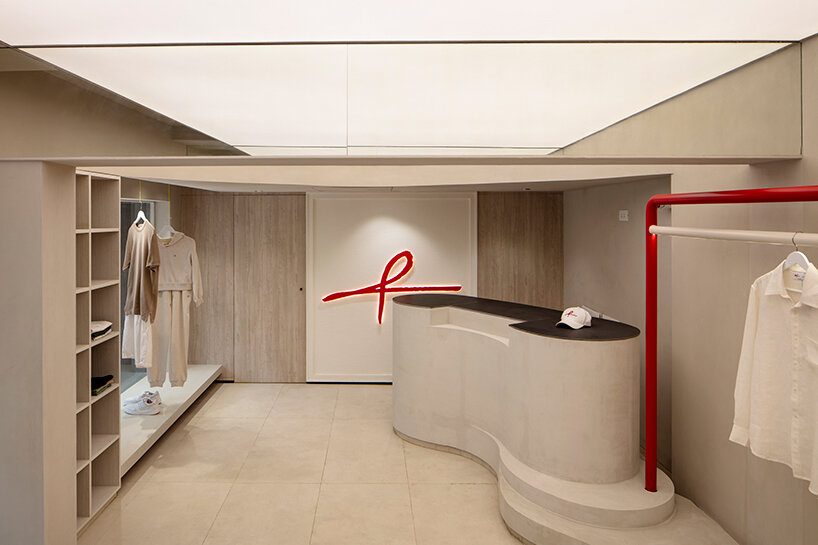 red sculptural elements define ARKS flagship store by anagram architects in mumbai