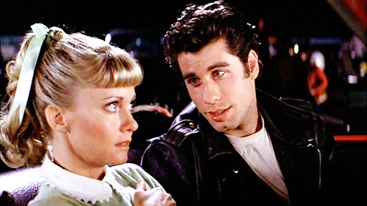 Olivia Newton-John as Sandy and John Travolta as Danny Zuko at the drive-in.