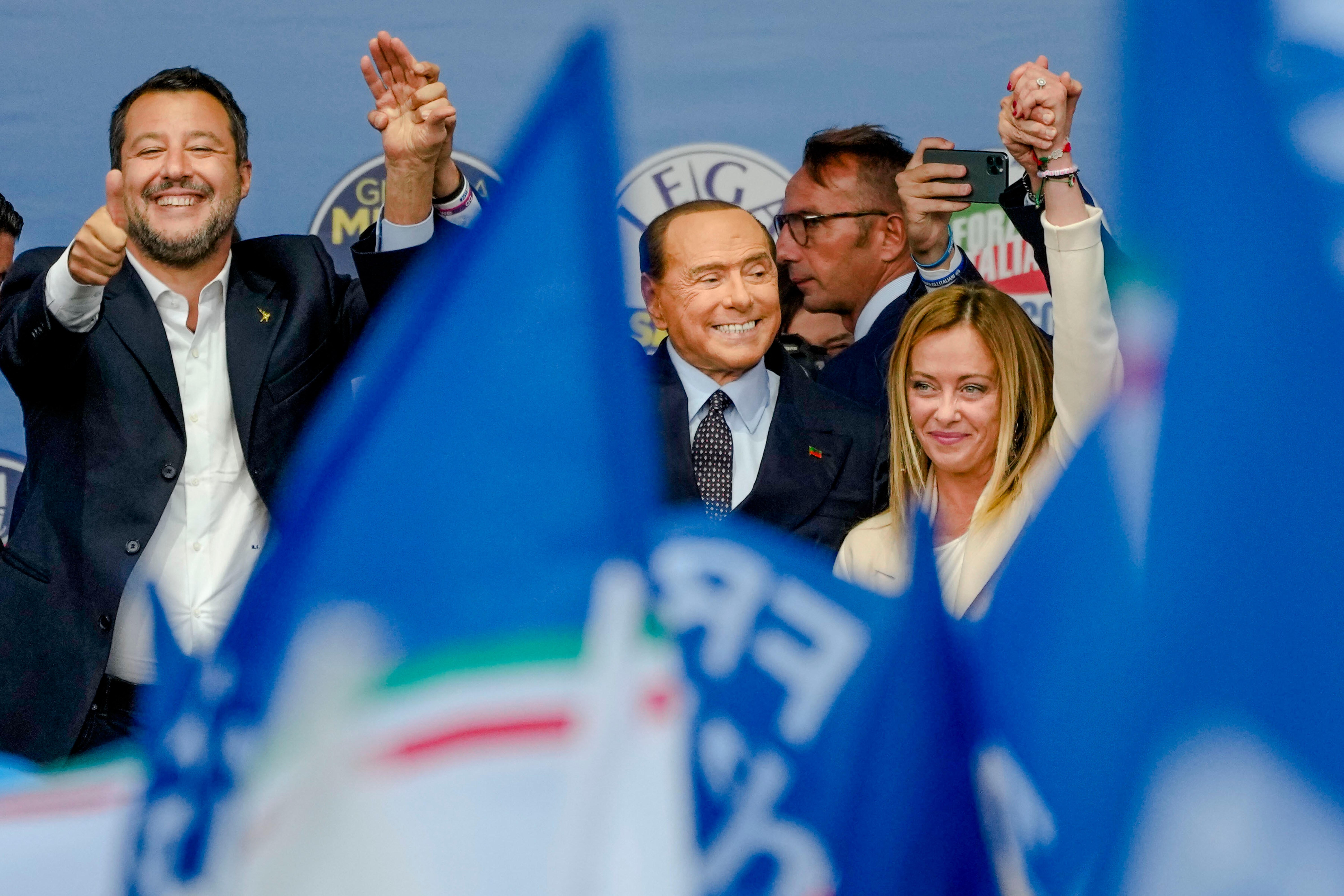 Matteo Salvini, Silvio Berlusconi, and Giorgia Meloni attending an electoral campaign rally.