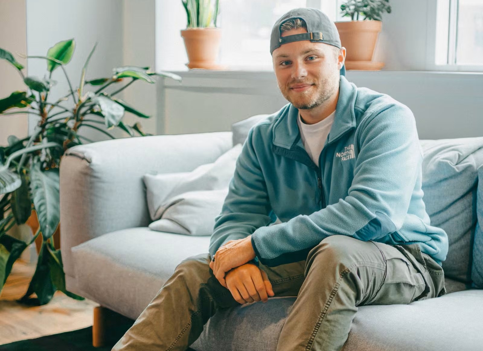 David Sloane, founder of Cambrean, sitting on a couch.