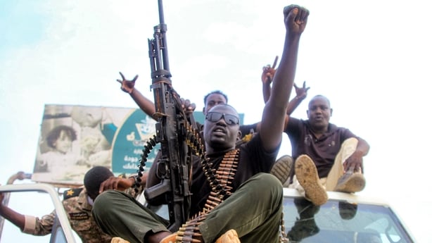 Sudanese army soldiers react during a military parade as part of religious commemorations by Muslim devotees of the birthday of Islam's Prophet Mohamed in Sudan's capital Khartoum