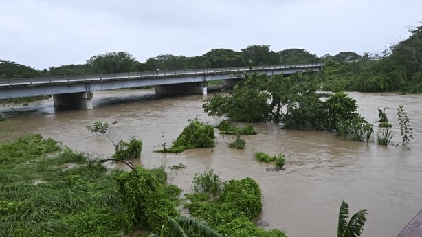 The Rio Cobre comes out of its banks near St. Catherine, Jamaica