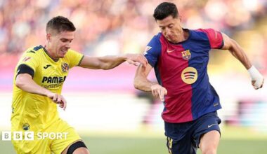 Robert Lewandowski of Barcelona running with the ball
