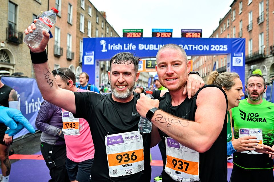 Shamrock Rovers manager Stephen Bradley, left, and assistant coach Glenn Cronin after competing in the 2025 Irish Life Dublin Marathon before they boarded a helicopter for Derry