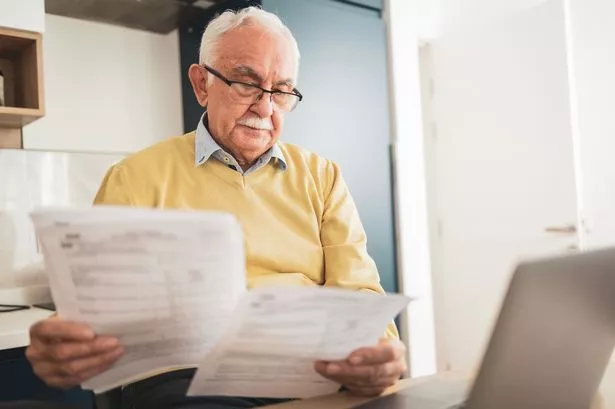 Man looking at pension documents