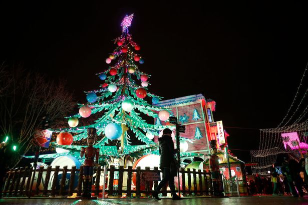 People visit the Christmas market at "Jardin des Tuileries"