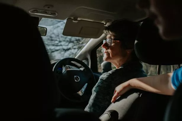 Mature woman driving car