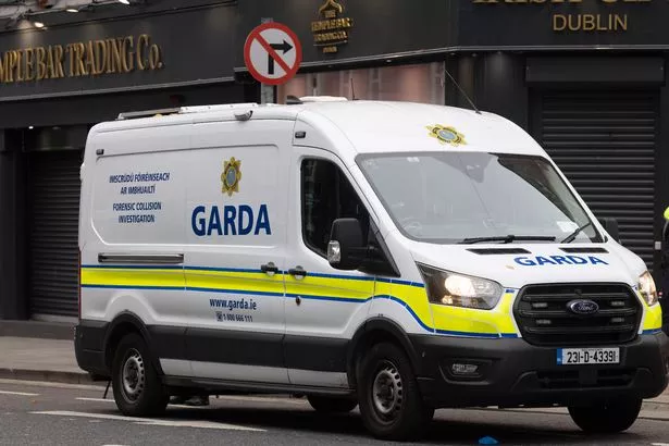 An Garda Siochana traffic Collision officers at the scene on Dame street, Dublin 