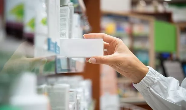 A person making up a prescription