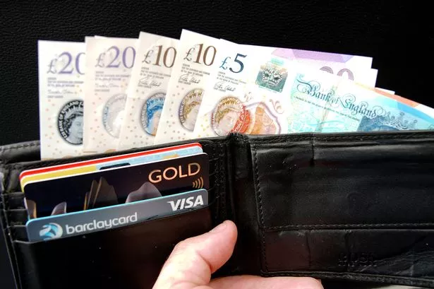 A picture of money in a wallet