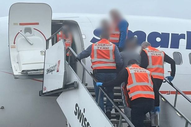 Deportees boarding a flight at Dublin Airport