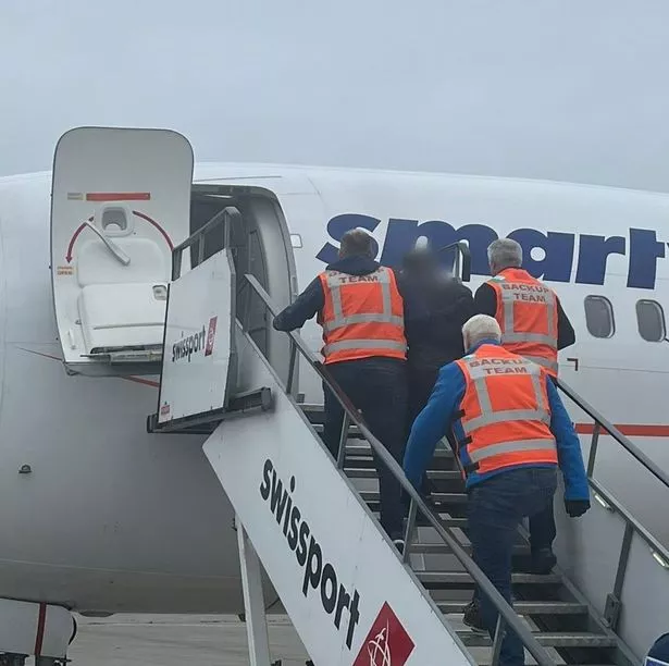 Deportees boarding a flight at Dublin Airport
