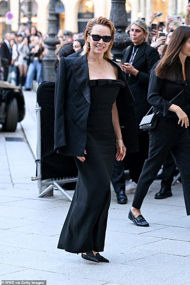 Pamela Anderson displayed her bold new hairstyle as she headed to the show, having unveiled her choppy red bob earlier this week