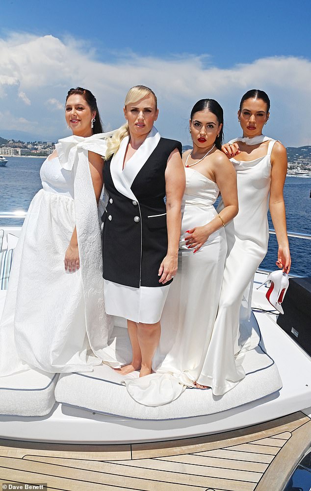 It comes after Wilson's co-producers on her musical comedy The Deb alleged the actor is sabotaging the film's long-delayed release so she can buy them out at a reduced cost, which she denied. Pictured L to R: Natalie Abbott, Rebel Wilson, Stevie Jean and Charlotte MacInnes