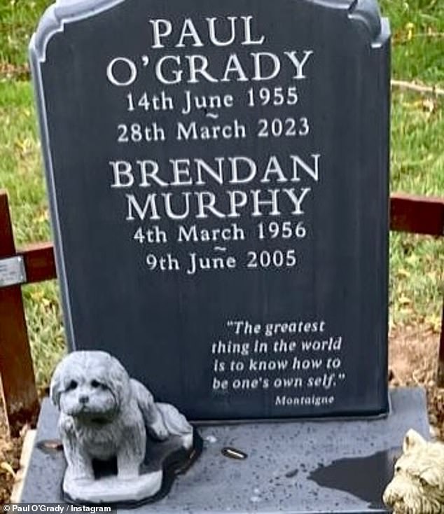 Paul's headstone is dark grey, and it bears Paul's name, as well as the name of his former long-term partner, Brendan Murphy
