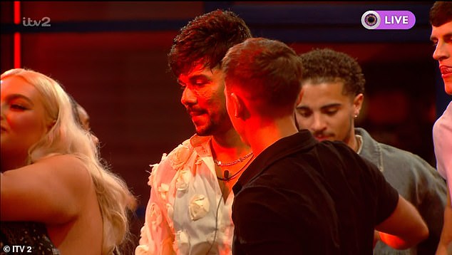 Shocked Gani was comforted by his fellow housemates as Big Brother ordered him to leave the house immediately