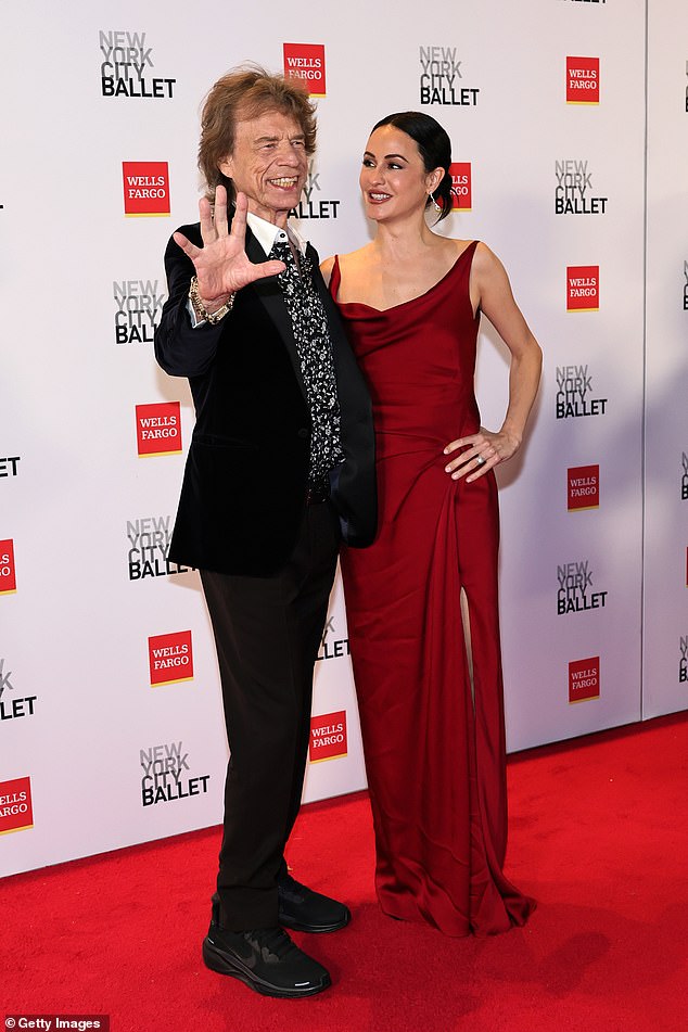 Jagger opted for a more casual ensemble with a black-and-white floral-print shirt and a black velvet tux jacket with peaked lapels
