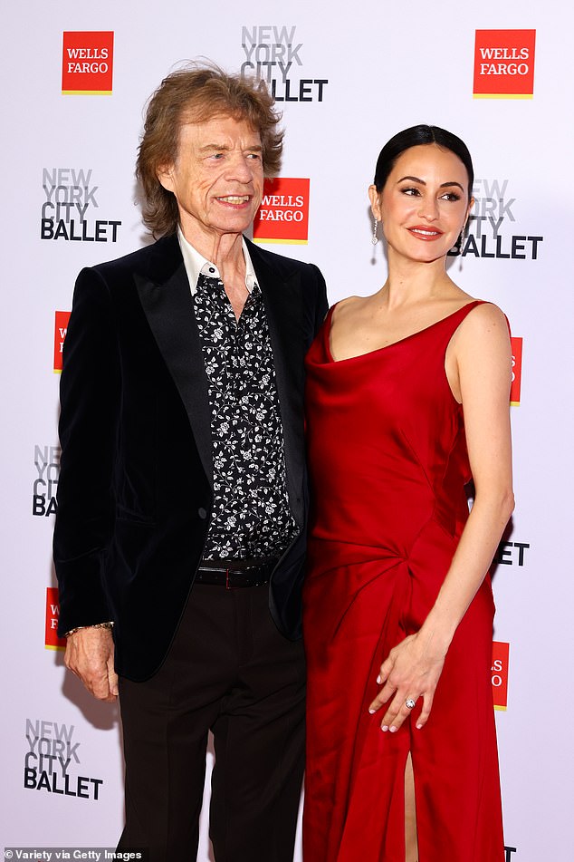 It featured a conservative neckline, but it's long skirt was enlivened by a sky-high slit. She completed the look with strappy black open-toe heels