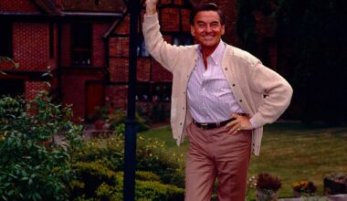 Bob Monkhouse stands outside his 17th century manor house in Eggington, which has now gone on sale for £3.15m