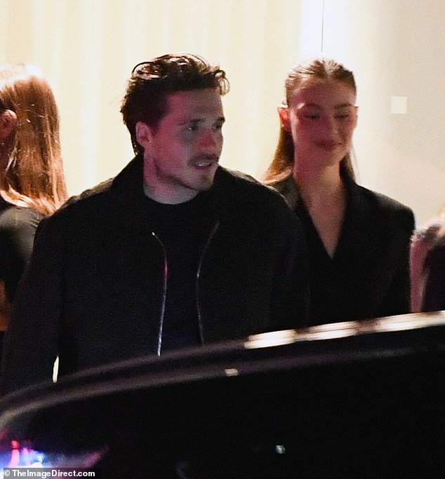Brooklyn looked smart in a tailored blazer and suit trousers, while his stunning wife added a pair of heeled boots