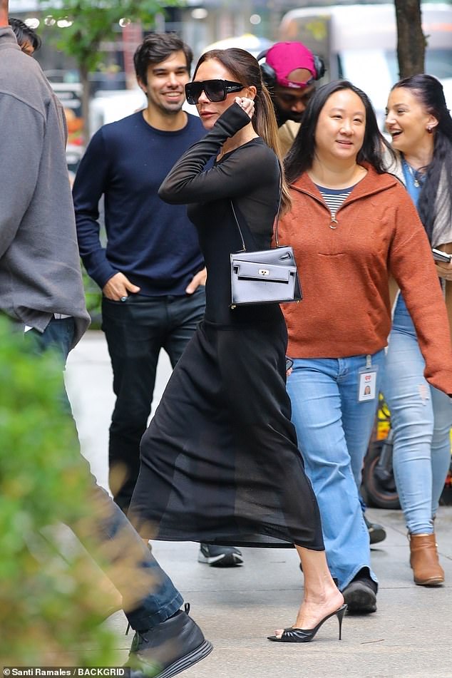 The Spice Girl, 51, looked typically chic in a semi sheer black dress and her signature heels and sunglasses as she grabbed lunch at Estiatorio Milos with a friend