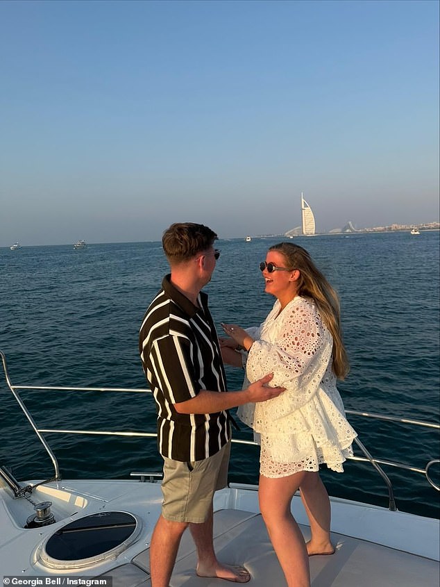 Georgia shared a video of the sweet moment the pair got engaged, where they were seen balancing on a rocky boat in Dubai with the Burj Al Arab in the background