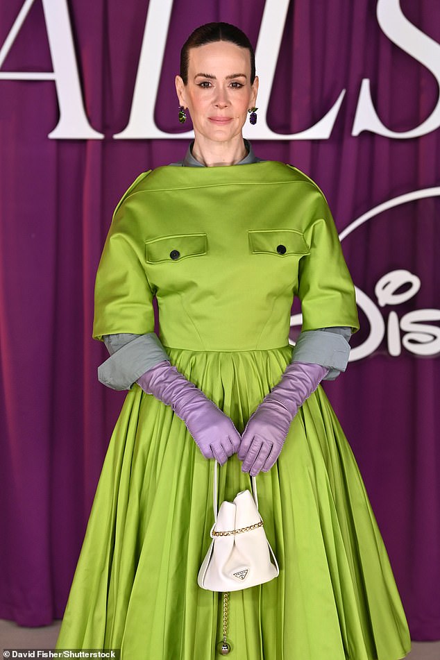 Sarah cut a chic figure in her green and lilac look, which she teamed with a white Prada bag