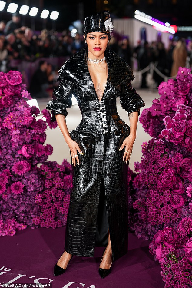 Teyana Taylor put on a racy display as she emulated Kim's outfit in a black crocodile skin dress with a corset front