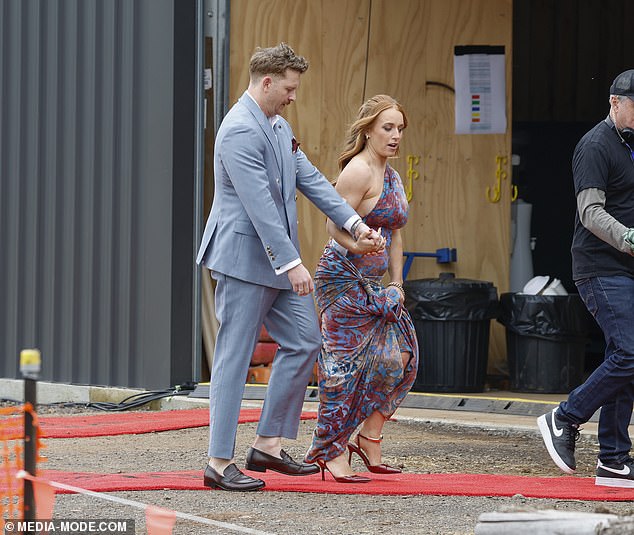 Emma left little to the imagination in a revealing backless dress