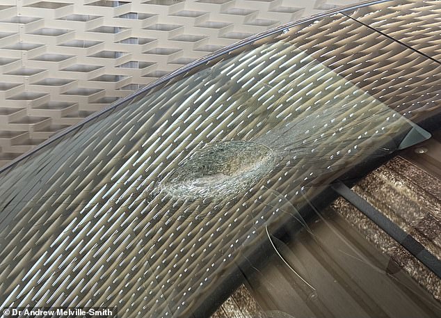 Bizarrely, Dr Melville-Smith discovered that the crater in his windshield was partly melted and was still warm to the touch when he pulled over to investigate