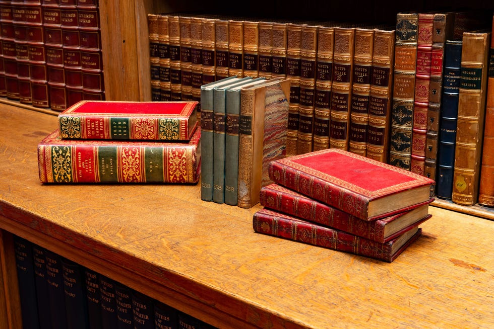 Collection of vintage books on a wooden shelf