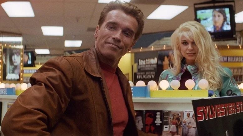 Arnold Schwarzenegger as Jack Slater checking out the video store in Last Action Hero
