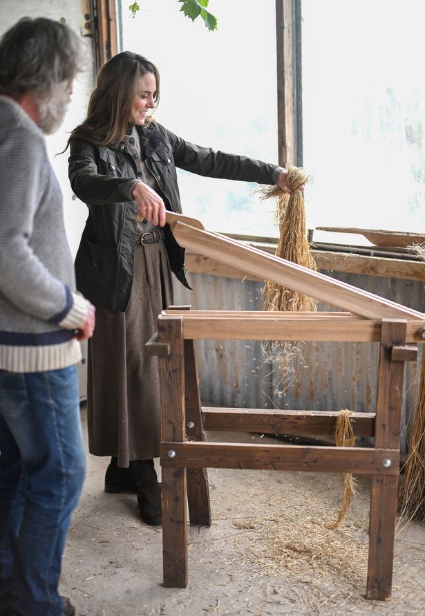 Kate tries her hand at using a restored machine that is used for breaking and scrunching 