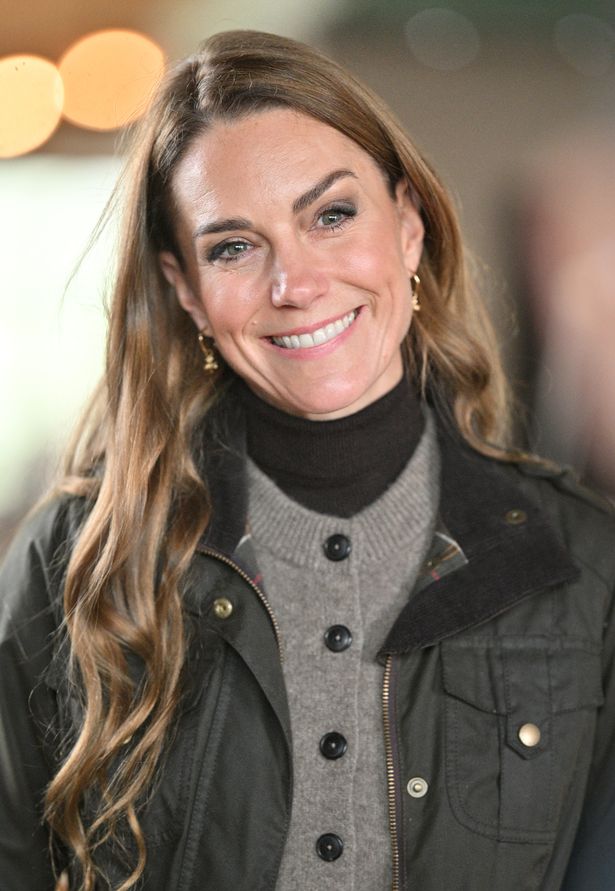 Kate smiles as she learns about growing flax to make linen