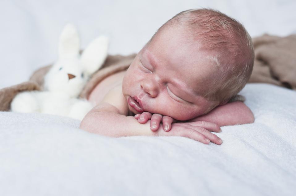 sleepy-baby-with-toy-rabbit