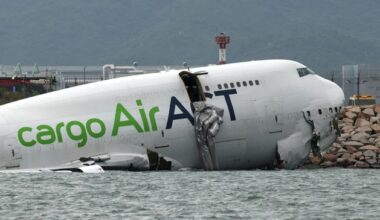 Two airport workers killed as cargo aircraft skids off a Hong Kong runway into the sea